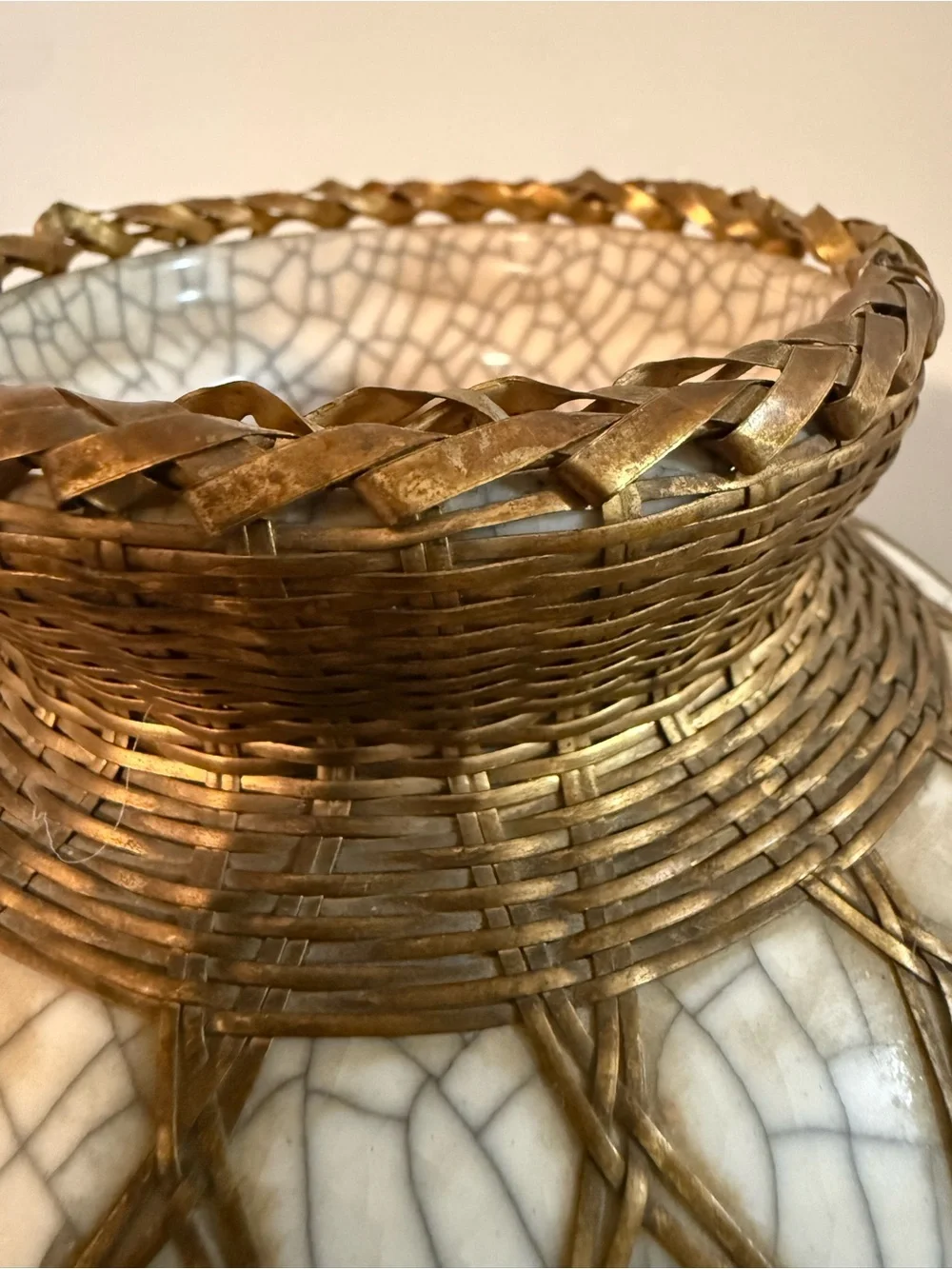 Japanese pottery vase craquelure glaze and a basketweave metal overlay.